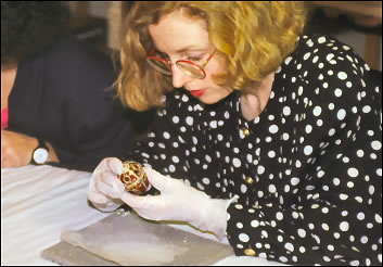 Margaret Kelly inspecting the Rosebud Egg